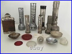 Collection of vintage torches all metal & some old spare torch parts